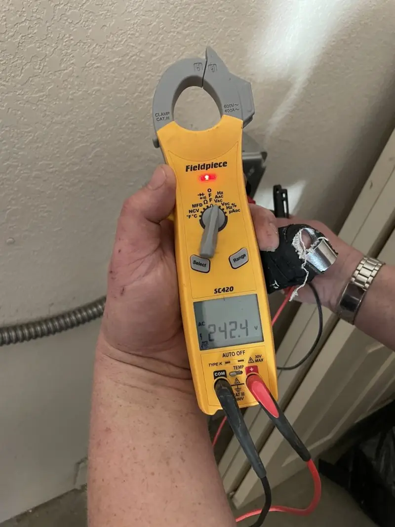 Voltage testing with clamp meter during Outlet Installation in Alamogordo